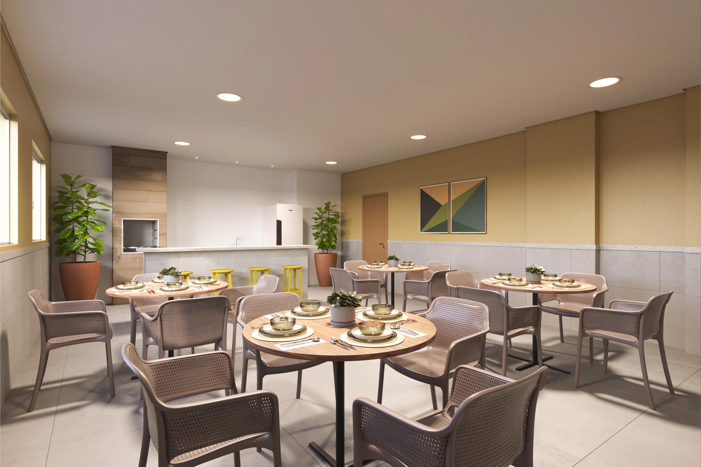 Espaço gourmet com churrasqueira e mesas para refeição