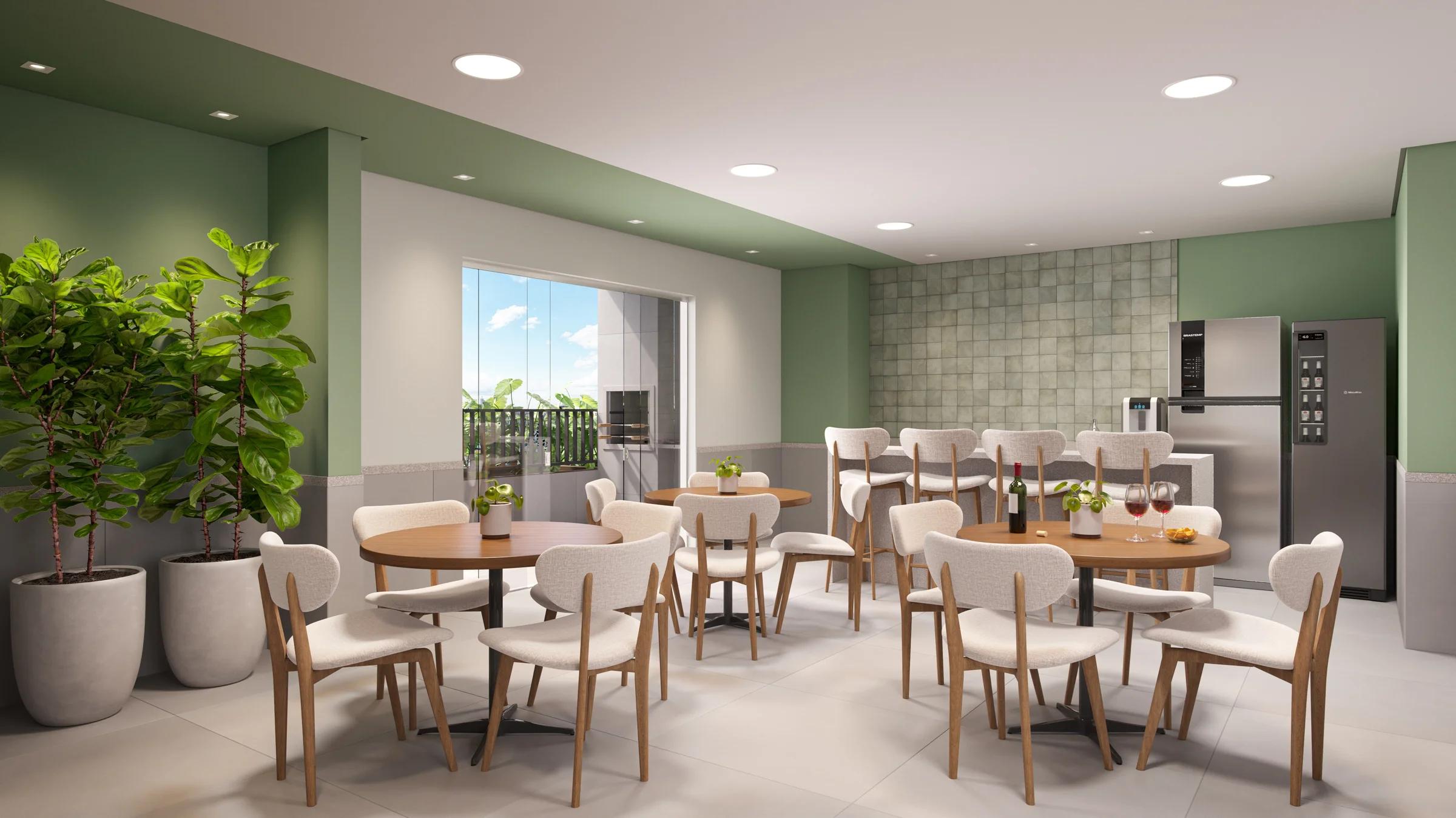Espaço gourmet com mesas redondas, bancada com banquetas e geladeiras