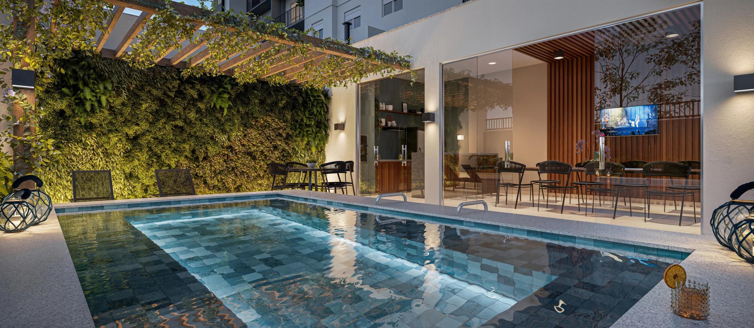 Piscina privativa integrada ao espaço gourmet com parede verde