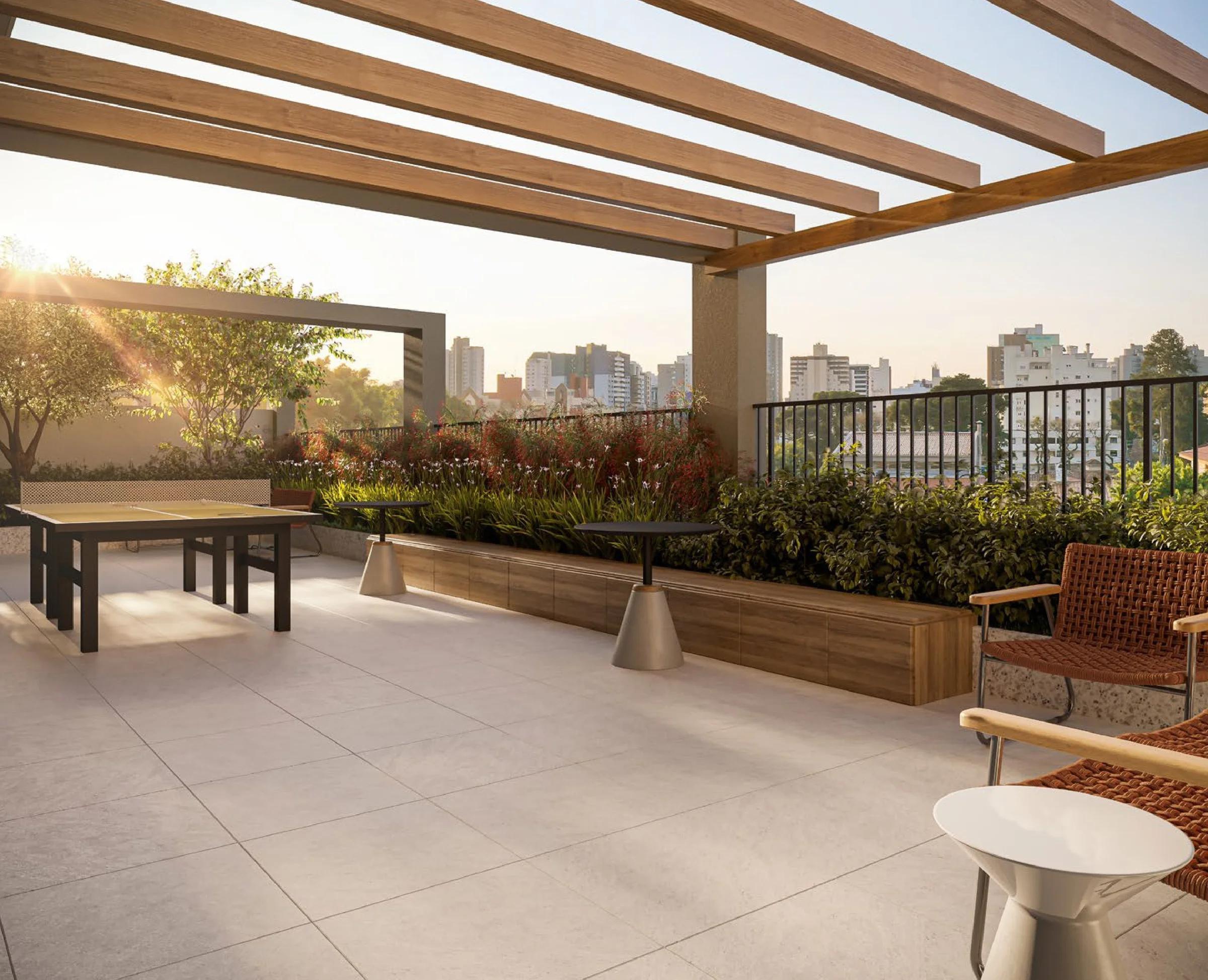 Terraço rooftop com pergolado de madeira, mesa de tênis de mesa e vista panorâmica