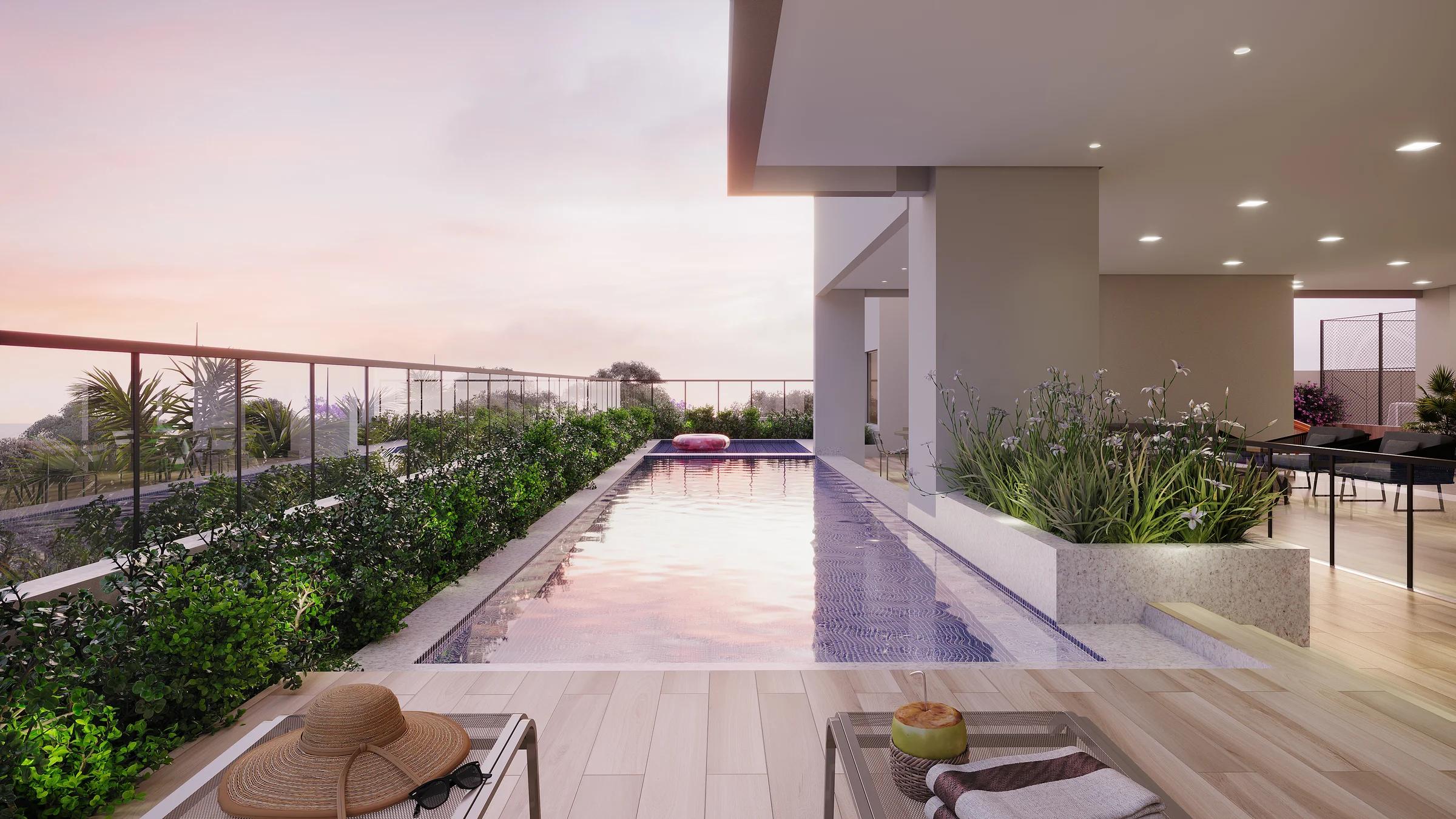 Piscina adulto com solarium ao entardecer