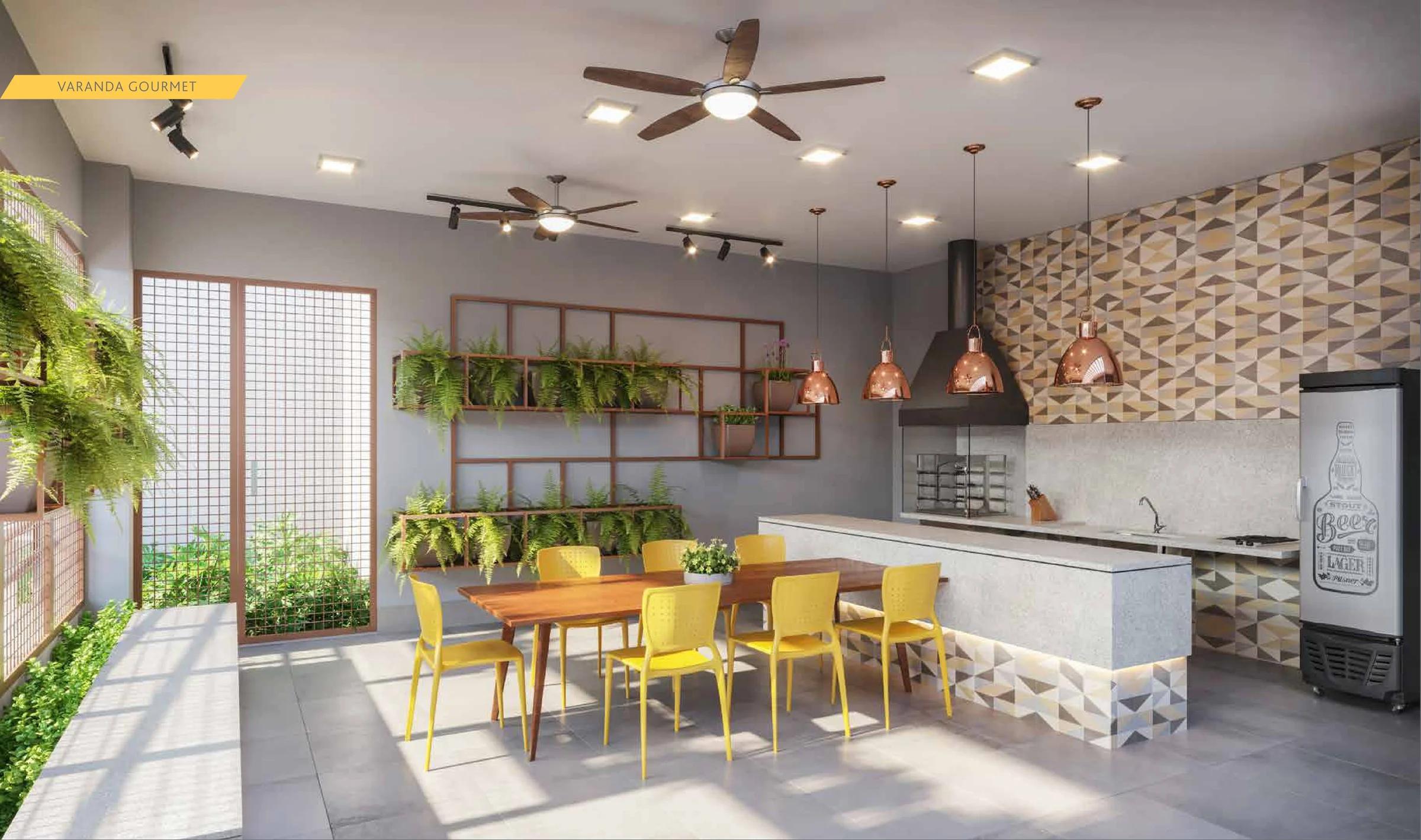 Varanda gourmet com bancada, churrasqueira e mesa com cadeiras amarelas