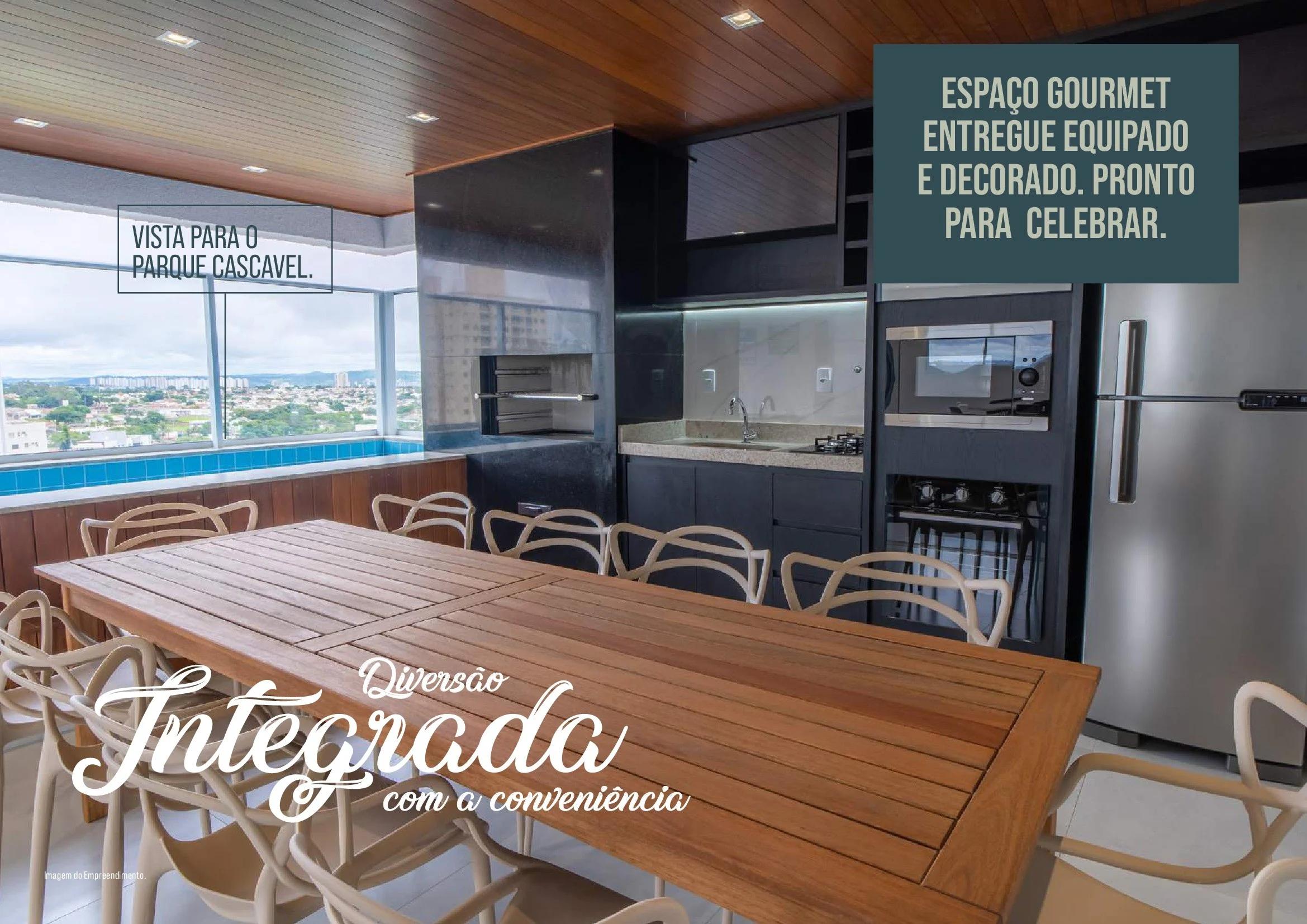 Espaço gourmet com churrasqueira, bancada equipada, mesa de madeira e vista panorâmica