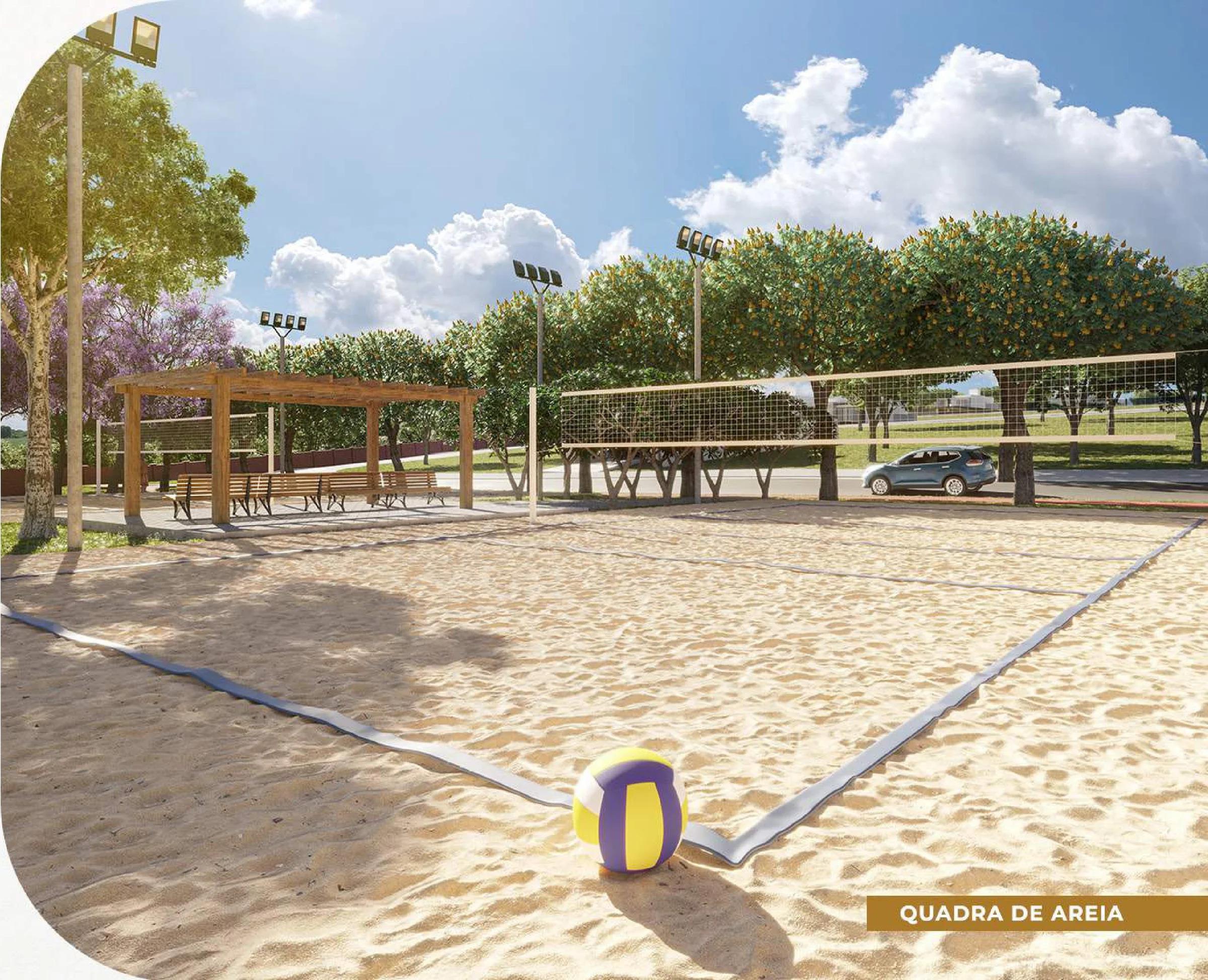Quadra de areia para esportes de praia com rede e área de descanso sombreada
