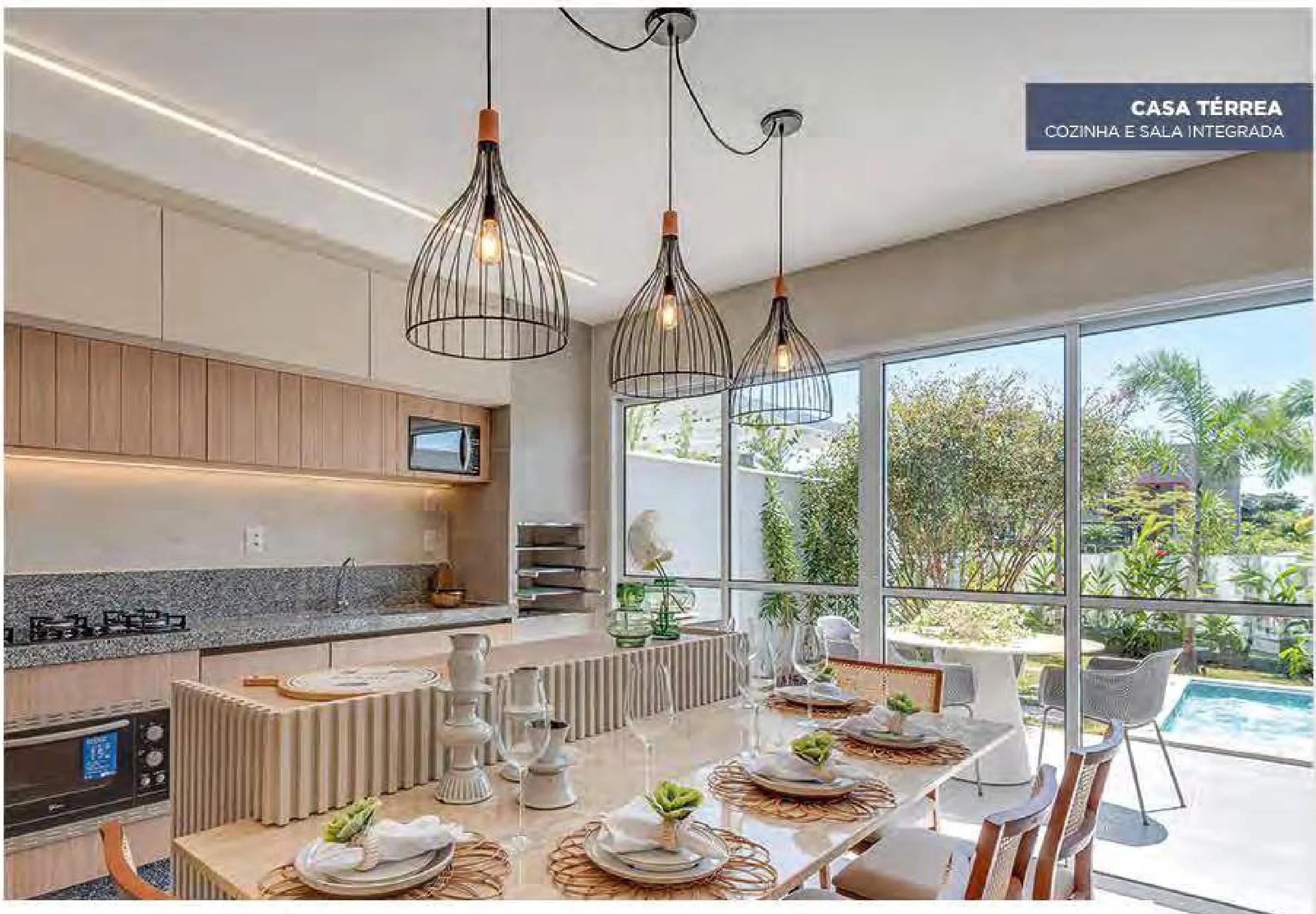 Cozinha e sala de jantar integradas da casa térrea com vista para o jardim