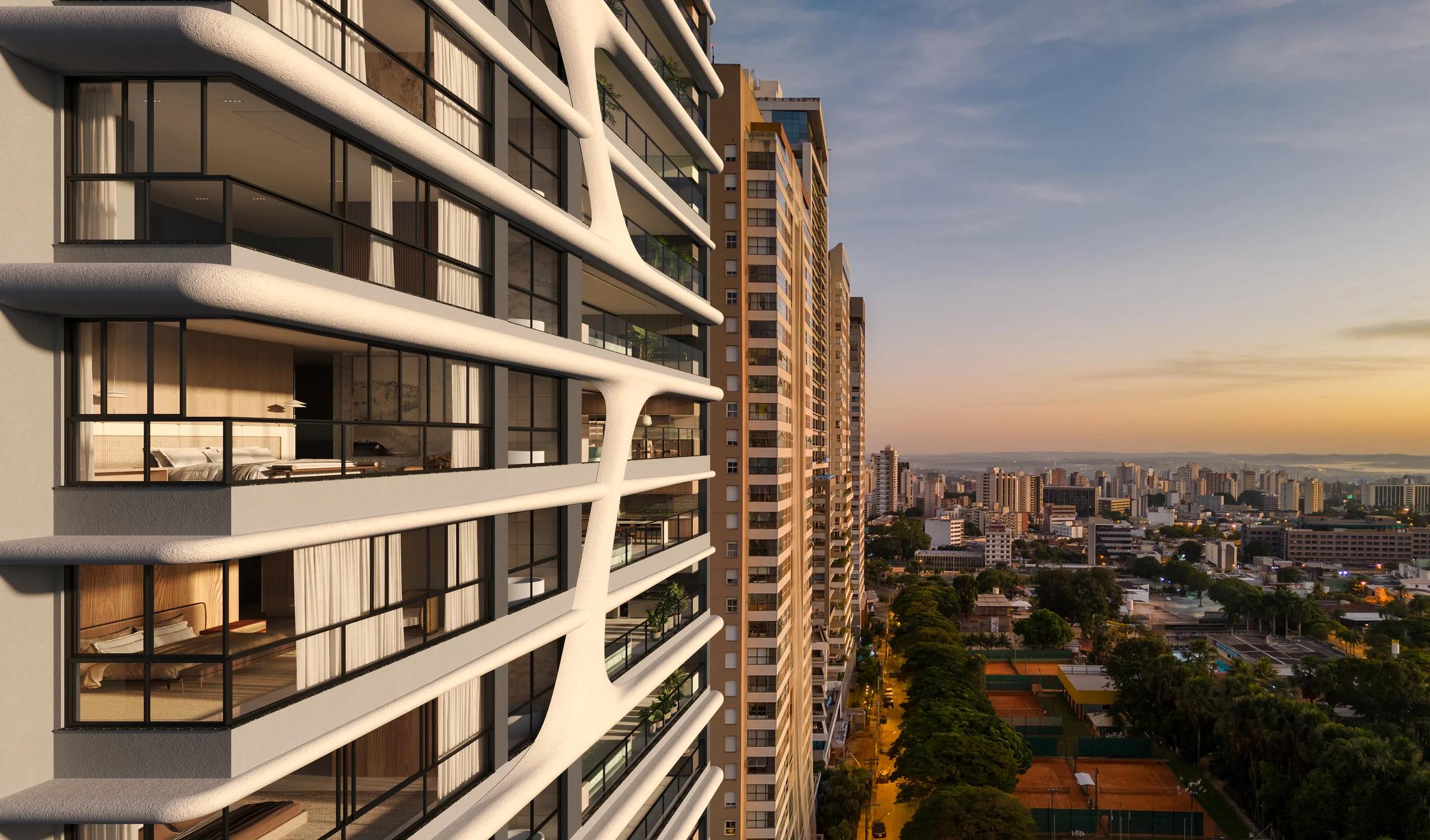 Vista aérea da fachada lateral e varandas do edifício ao entardecer