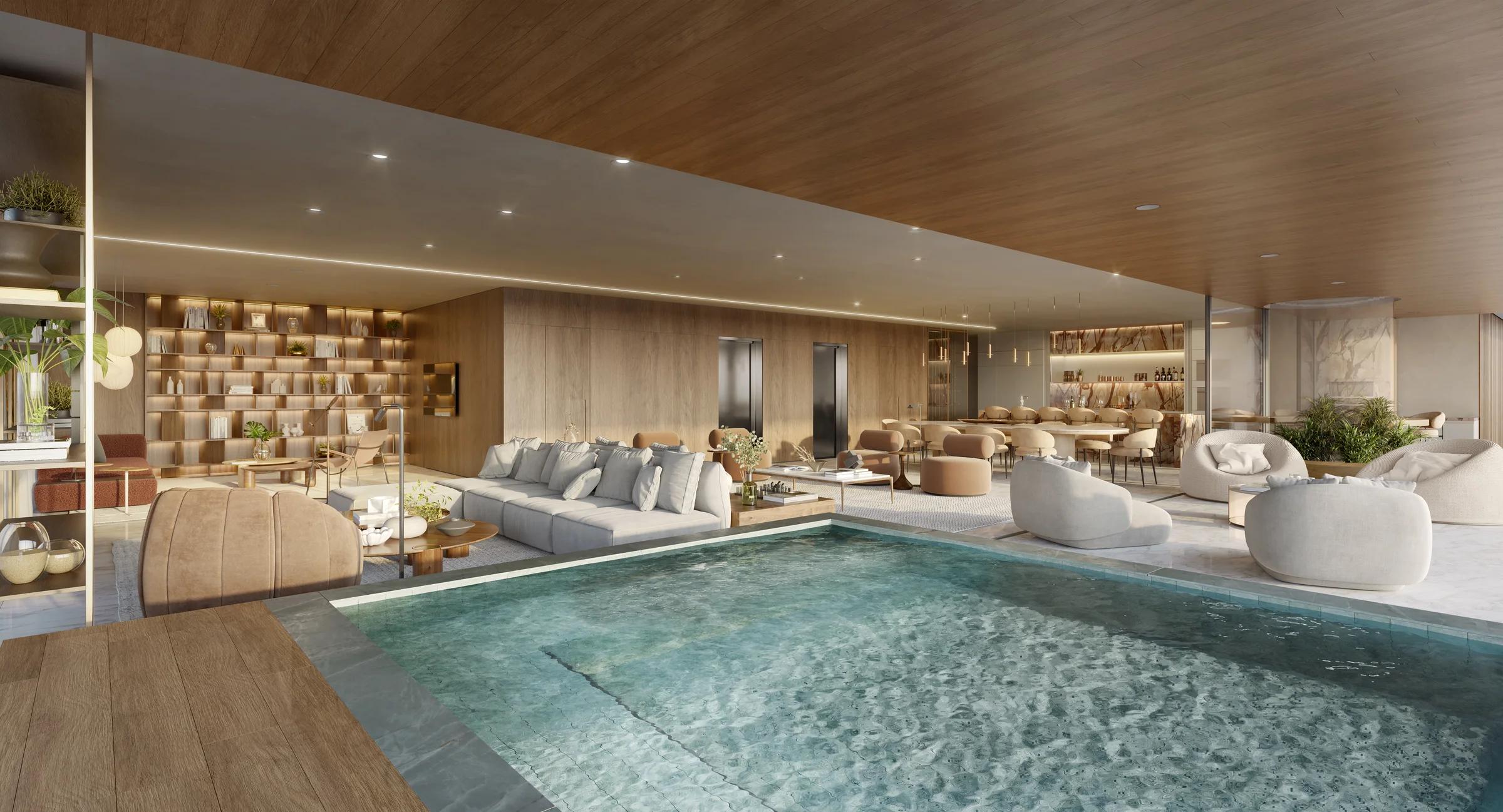 Área comum coberta com piscina integrada, lounge mobiliado e estante de livros