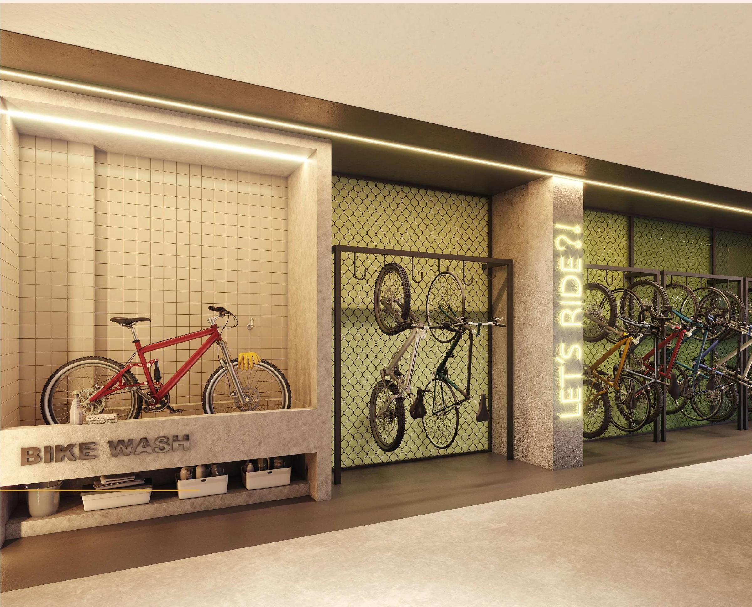 Área de bike wash e bicicletário com suporte na parede