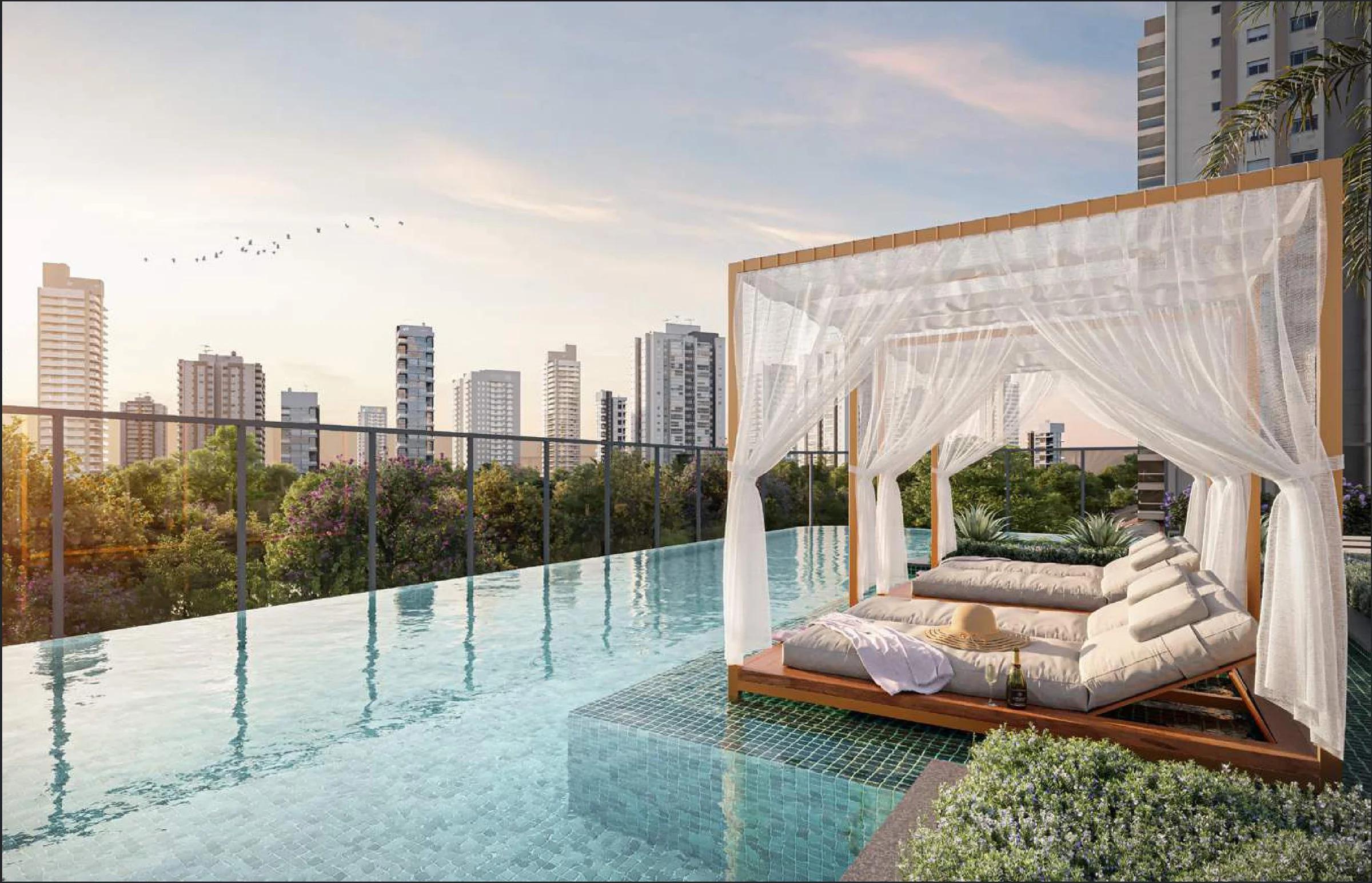 Piscina com borda infinita, cabana com dossel e espreguiçadeiras com vista para a cidade