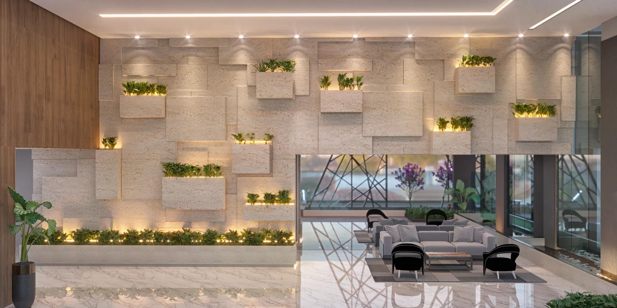 Lobby de entrada com parede em pedra esculpida, jardineiras e área de estar