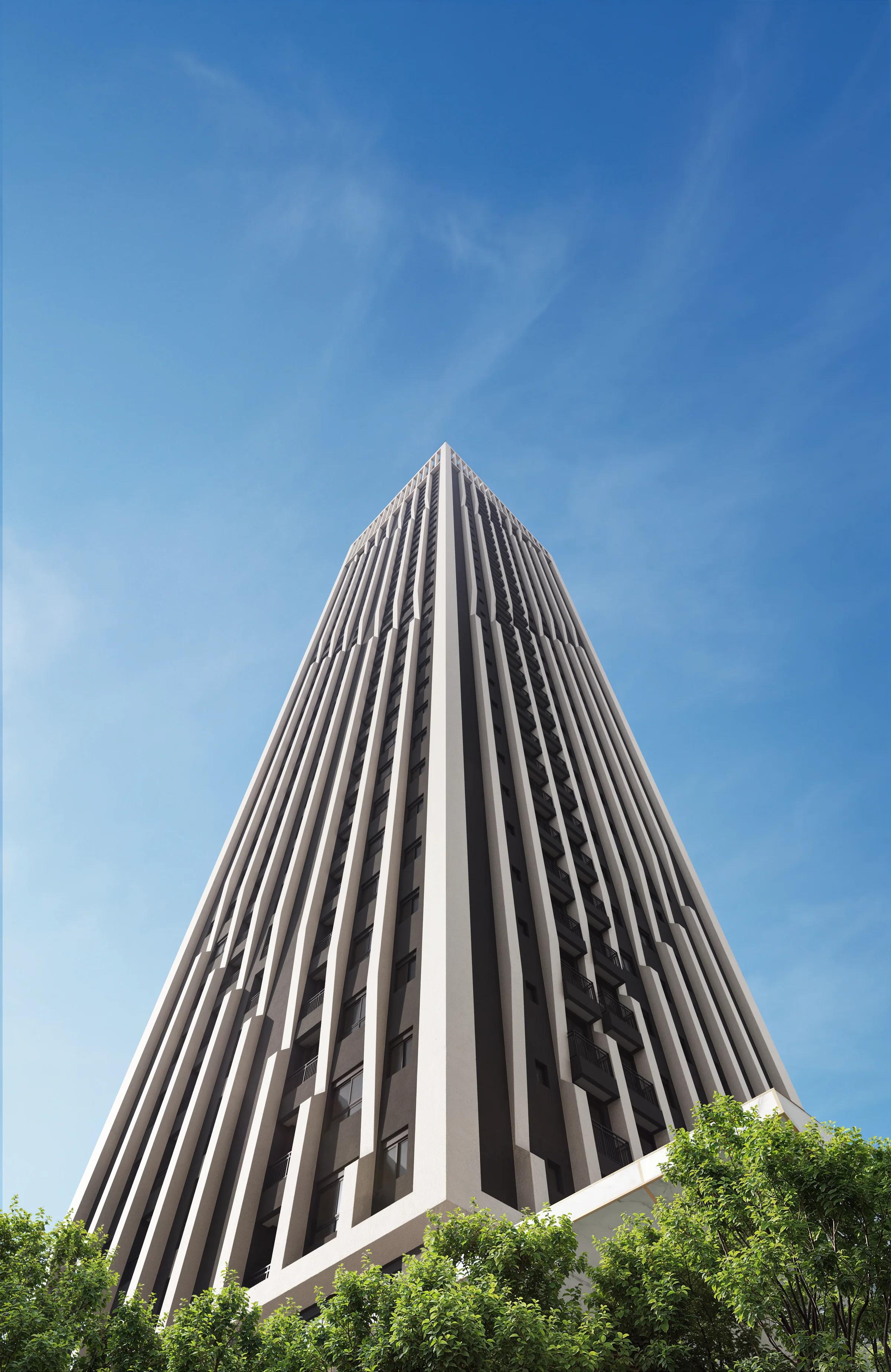 Vista em perspectiva da fachada da torre vista de baixo contra o céu azul