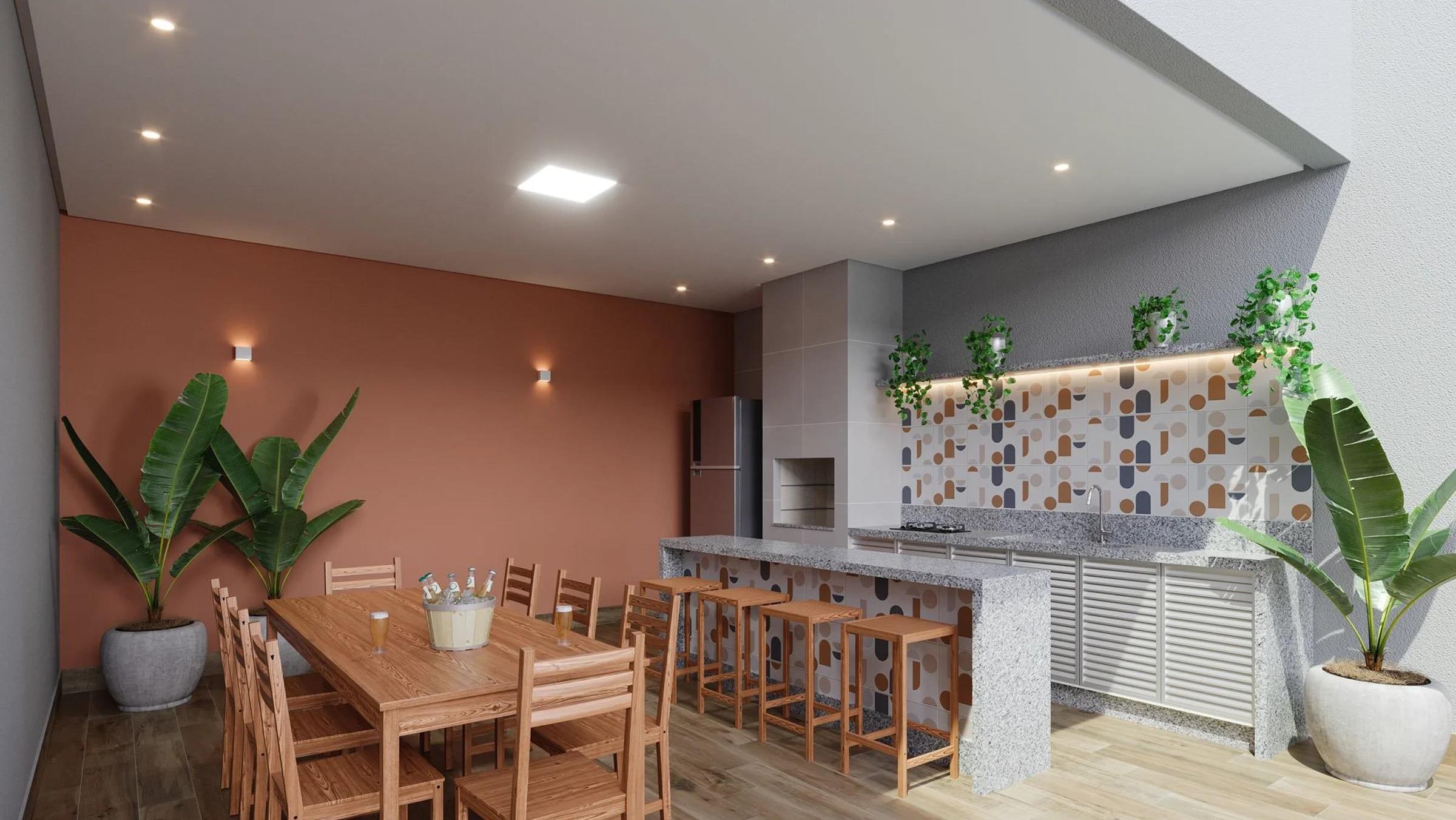 Espaço gourmet com bancada em granito, churrasqueira e mesa de jantar em madeira