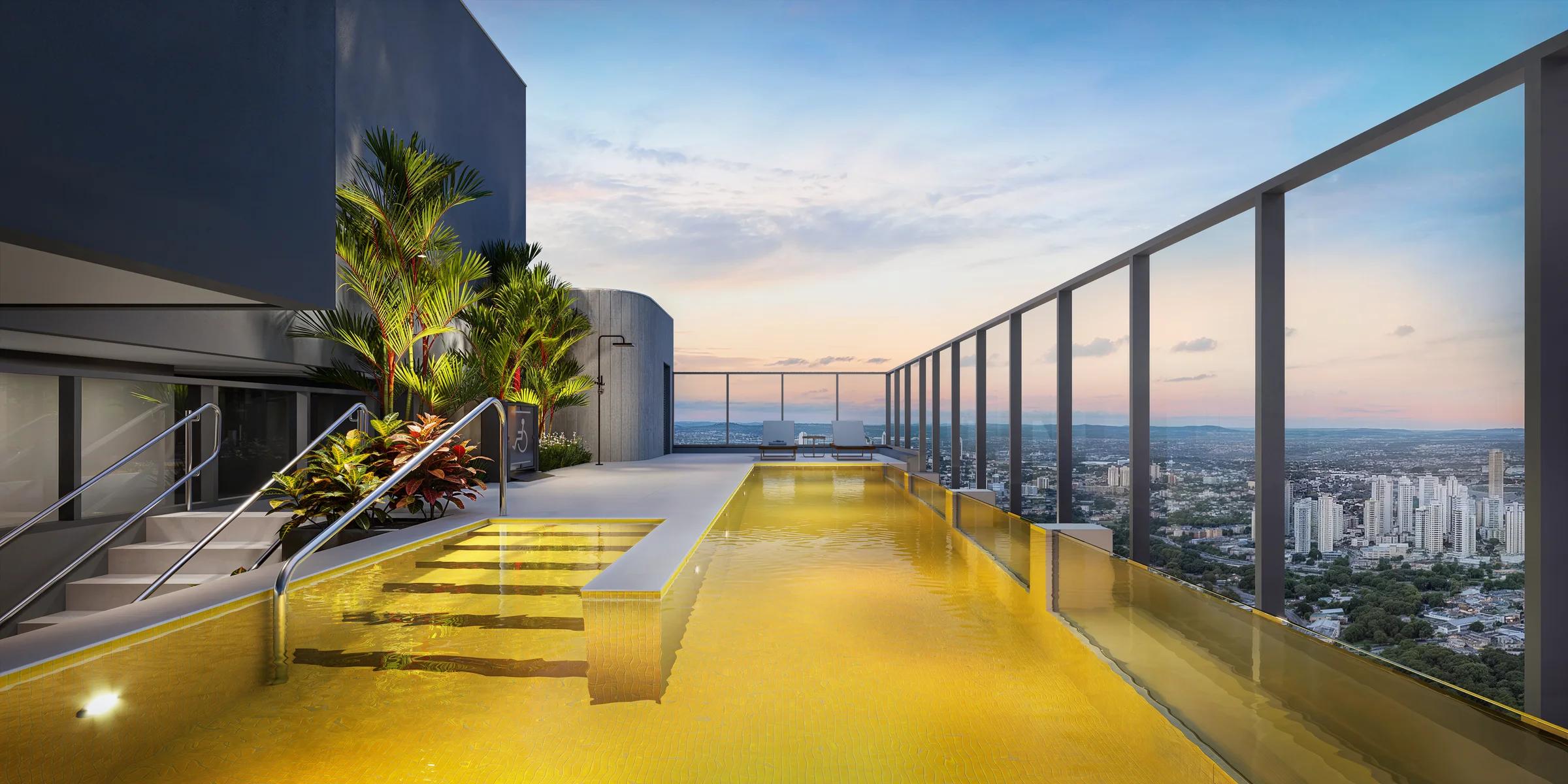Piscina de borda infinita no rooftop com iluminação noturna e vista aberta da cidade